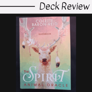 A guidebook titled Spirit Animal Oracle by Colette Baron-Reid features a white deer with floral antlers and hanging ornaments. The image has the text Deck Review at the top.