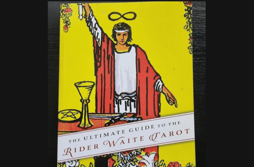 A Book Review showcases The Ultimate Guide to the Rider Waite Tarot by Johannes Fiebig and Evelin Bürger, featuring a cover with the iconic Magician card illustration.