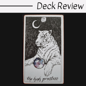 A tarot card illustration of a white tiger sits beneath a crescent moon, holding a sphere with a galaxy pattern. The card is labeled The High Priestess from The Wild Unknown Tarot. Deck Review is written above the card.