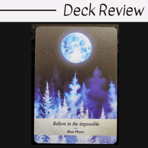 A Moonology card with a glowing blue moon above purple and blue trees. The card reads “Believe in the impossible — Blue Moon.” The background is dotted with stars. Deck Review is written at the top of the image.