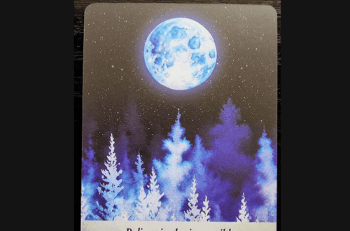 A Moonology card with a glowing blue moon above purple and blue trees. The card reads “Believe in the impossible — Blue Moon.” The background is dotted with stars. Deck Review is written at the top of the image.