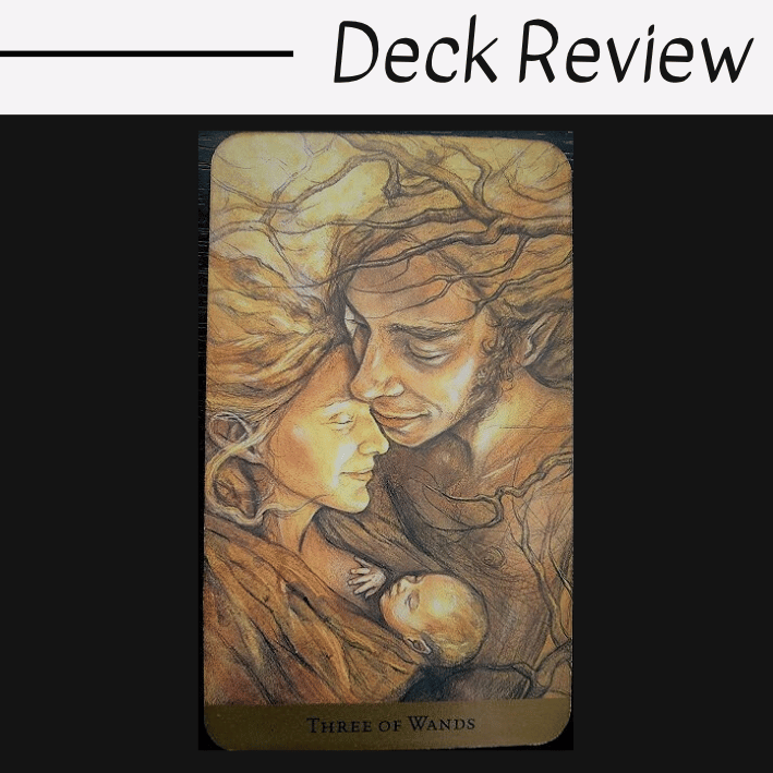 A Tarot of the Hidden Realm card, the Three of Wands, shows two adults and a baby with serene expressions, their bodies and hair entwined with tree branches, creating a warm, earthy scene.