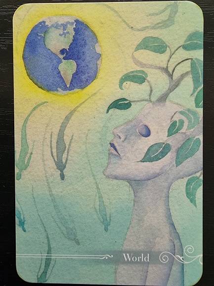 A watercolor illustration from the Guardian Tarot shows a serene figure with a tree-like head, leaves, and swirling lines gazing upward at a glowing Earth. The card is labeled World at the bottom.