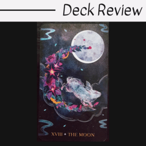 A tarot card from the Oriens Animal Tarot labeled XVIII + The Moon shows a luminous rabbit leaping toward a full moon, surrounded by dark clouds, purple flowers, and swirling blue accents. The words Deck Review are above.