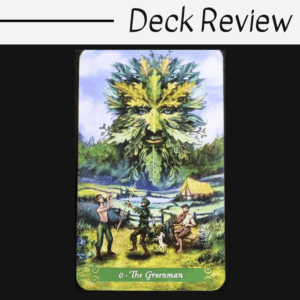 A tarot card from the Green Witch Tarot labeled 0 - The Greenman shows a leafy face in the sky, three people, and a dog in a lush landscape with hills, trees, and a yellow tent. Text above reads, Deck Review.