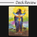 An oracle card from the Sacred Earth Oracle titled Expectation shows a cloaked figure with a glowing butterfly over their back, vibrant colors radiating outward, and animals including buffalo in the foreground. The words Deck Review are above the image.