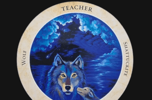 A circular card from the Crystal Medicine Oracle featuring a wolf and pup against a blue, cloudy night sky. The border reads Wolf, Teacher, Shattuckite, and 30. The top of the image says Deck Review.