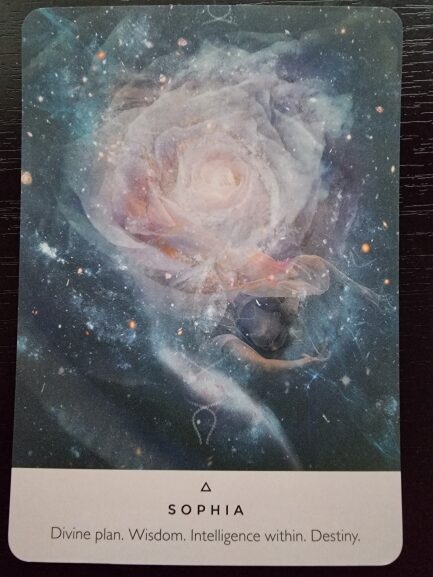 A tarot card from The Rose Oracle features a cosmic, ethereal rose at its center, surrounded by swirling galaxies and stars. At the bottom, the card reads: SOPHIA. Divine plan. Wisdom. Intelligence within. Destiny.