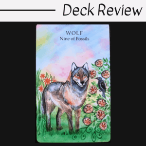 A tarot card with an illustration of a wolf standing in grass and flowers. The card reads “WOLF Nine of Fossils” with a small bird nearby. The image background is pastel, and “Deck Review” is written above.