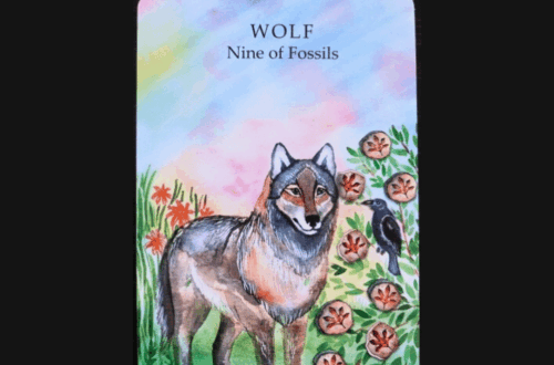 A tarot card with an illustration of a wolf standing in grass and flowers. The card reads “WOLF Nine of Fossils” with a small bird nearby. The image background is pastel, and “Deck Review” is written above.