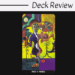 A colorful tarot card labeled Page of Wands features a serious man with surreal, abstract shapes, vibrant patterns, and bold colors surrounding him on a black background. The text above reads Deck Review.