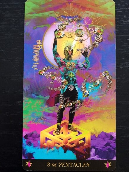 A colorful Starman Tarot card titled 8 of Pentacles shows a figure standing on a geometric cube, surrounded by glowing pentacles and vibrant, swirling patterns against a bright, abstract background.