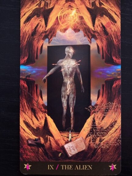 A Starman Tarot card titled IX / The Alien shows a metallic, androgynous figure with illuminated lines standing among surreal red rocks, surrounded by mystical objects like a book, a scroll, and glowing symbols.