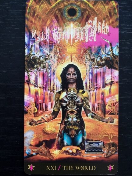 A vibrant tarot card from the Starman Tarot, titled XXI / The World, depicts a powerful, dark-skinned figure adorned with ornate gold and cosmic symbols, standing in a surreal, glowing industrial setting infused with radiant energy.
