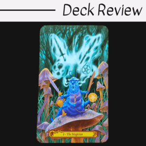 A colorful Tarot in Wonderland card titled The Magician shows a blue caterpillar with arms, holding magical items, sitting on a mushroom. In the background, a butterfly-shaped mist with symbols appears over grass and mushrooms.