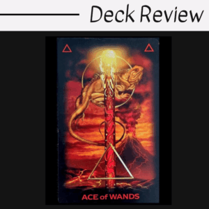 A Tarot of Dreams card labeled Ace of Wands features a lizard curled around a fiery, glowing wand with a volcano erupting in the background. Bright red, orange, and yellow tones dominate the scene.