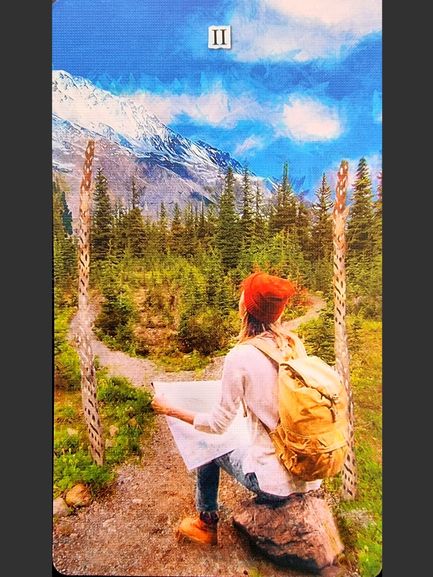 A person with a yellow backpack and red beanie sits on a rock, holding a map, facing a mountain landscape with snow-capped peaks and pine trees, framed by two carved wooden posts like a scene from the Superlunaris Tarot.