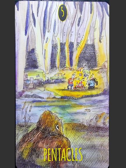 A tarot card from The Shadowland Tarot, labeled 5 Pentacles, shows a wilderness scene. In the foreground, a furry creature (Bigfoot) gazes toward a campsite where people sit around a fire among tall, pale trees at night.