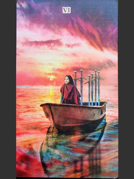 A woman sits in a small boat with six swords, drifting across calm, colorful waters at sunset. The sky glows with pink, orange, and purple hues, reflecting on the water’s surface—a serene scene from the Superlunaris Tarot.