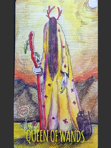 A tarot card illustration from The Shadowland Tarot depicts the Queen of Wands in a yellow robe with red symbols, holding a red staff before mountains and a bright sun. A black cat and a small sunflower sit at her feet.