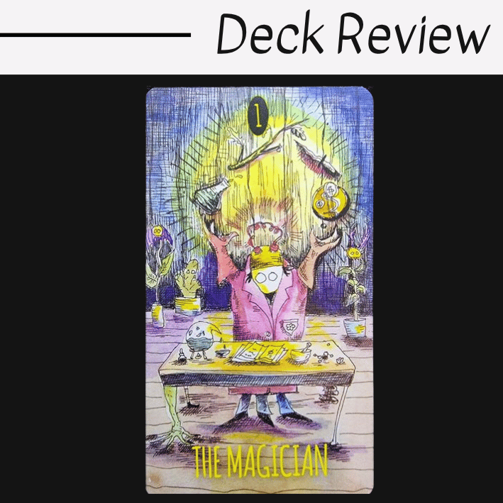 A tarot card illustration titled The Magician from The Shadowland Tarot shows a masked figure in a pink robe with arms raised, surrounded by magical tools on a desk, with a yellow glow in the background and plants nearby. Deck Review is written above.