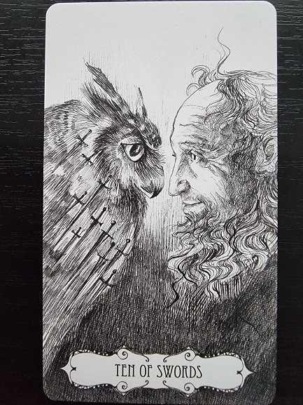 A black and white tarot card labeled XVIII • THE MOON shows two figures on separate cliffs, surrounded by flowing, ribbon-like shapes, with a large full moon above them in a dramatic, mystical scene that evokes the artistry of creative writing.