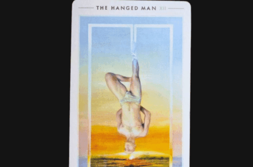 A tarot card titled The Hanged Man from the Fountain Tarot shows a glowing figure suspended upside down over a bright horizon, with the words Deck Review above the image on a white background.