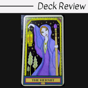 A colorful tarot card titled The Hermit from The Wandering Star Tarot features a robed figure holding a lantern and staff, surrounded by plants. The card’s border reads Healing, Solitude, Inner Work. Text above says Deck Review.