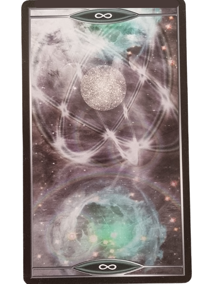 A Quantum Tarot Version 2.0 card featuring cosmic imagery: a glittery silver sphere at the center, swirling white energy patterns, and greenish-blue nebulae above and below. Infinity symbols grace the top and bottom borders.