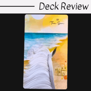 A tarot card titled The Sun from the Tarot of Oneness deck shows a white horse facing a sunny beach with waves and sandcastles. The card is under a header reading Deck Review.