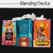 Three tarot card decks in colorful boxes—The Muse Tarot, The Light Seers Tarot, and The Tarot of Curious Creatures—are displayed side by side with a white crystal above them. Text reads “Blending Decks,” perfect for exploring blended decks.