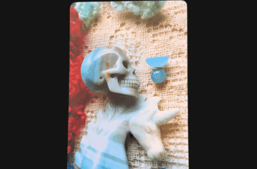 A tarot card from the Crystal Skull Tarot labeled Knight of Cups shows a skull and knight chess piece in cool tones, set against lace and colorful yarn, with a small blue chalice above them. Deck Review is written at the top.