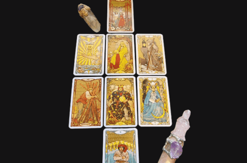 A tarot spread of nine cards arranged in a cross pattern, placed on a black surface with two crystal wands at the sides. The phrase "I am enough" appears alongside the title Tarot Spread at the top right on a white background.