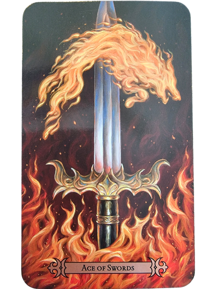 A tarot card from the Modern Spellcaster's Tarot, the Ace of Swords shows a glowing silver blade emerging from swirling flames. A lion’s head forms in the fire above, with flames enveloping the hilt and base.