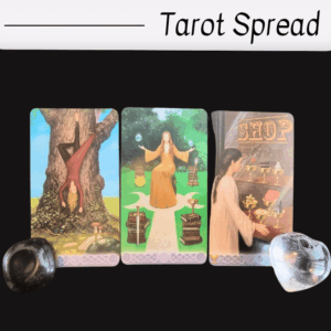 Three tarot cards are displayed side by side on a black background with “Tarot Spread” written above, inviting you to overcome a fear-based block. Two stones, one black and one clear, are placed at the corners of the cards.