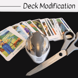 A set of tarot cards spread out with a corner rounder punch and a pair of large scissors labeled “TITANIUM COATED” on a black surface, highlighting modification. The words Deck Modification appear at the top of the image.