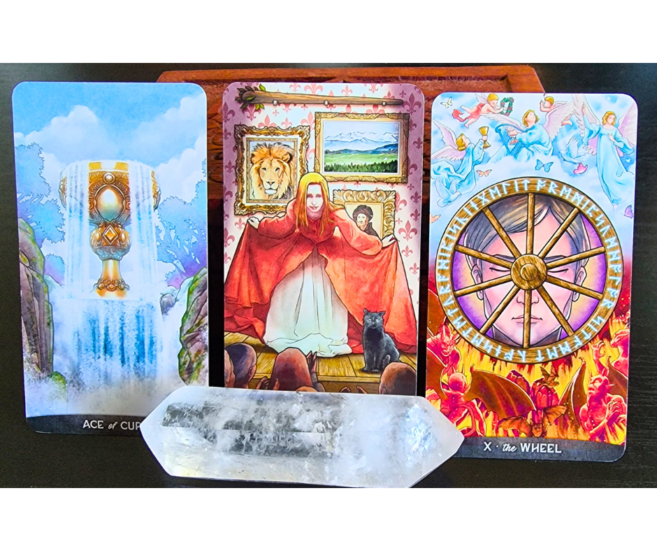 Three tarot cards—Ace of Cups, Strength, and The Wheel—are displayed upright behind a clear quartz crystal, symbolizing the power of choice. The cards feature vibrant illustrations and mystical symbols.