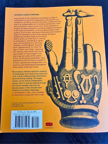 The back cover of A Dictionary of Symbols features a yellow background with a black illustration of a hand filled with various symbolic objects. Text on the left provides a description and reviews, while a barcode appears at the bottom left.