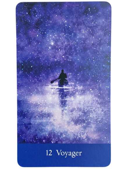 A person paddles a canoe through a dreamy, star-filled purple and blue cosmic scene. At the bottom, the card from The Sacred She Tarot reads 12 Voyager in white text on a blue background.