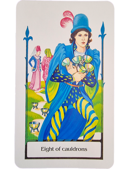 A Tarot of the Old Path card, the Eight of Cauldrons, depicts a figure in vibrant blue and yellow attire holding several cups, with more on the ground. In the background stand two figures, one dressed in pink and the other in green.