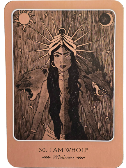 A tarot card from the Wild Woman Oracle features a woman with long black hair, one side light and the other dark. Behind her stand a lion and a wolf, with the sun and moon above. The card is labeled “30. I AM WHOLE – Wholeness.”.