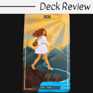 A tarot card from Earth Woman Tarot titled The Fool shows a woman in a white dress walking barefoot towards the edge of a cliff, with mountains, a flowing river, and a sunlit sky in the background. The text Deck Review appears above the card.