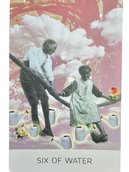 Two children hold hands and balance on a large log against a dreamy pink sky with clouds. Watering cans and a rose are scattered beneath them. From The Rosebud Tarot, this card is labeled Six of Water.