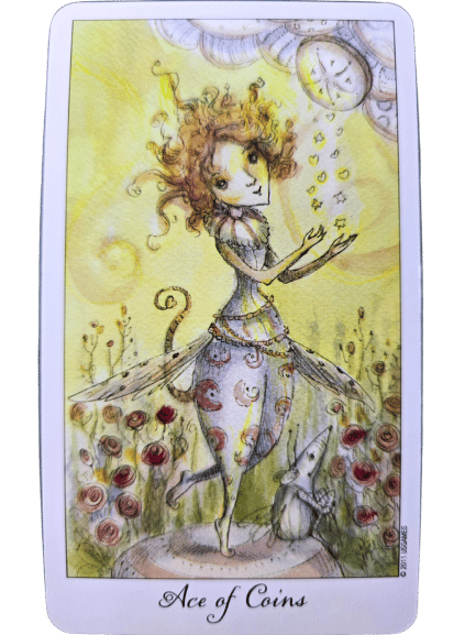 A whimsical, fairy-like figure with curly hair catches golden coins falling from a sun in the Joie de Vivre Tarot. She stands on one foot amid blooming flowers, with a small animal at her feet. The card reads Ace of Coins at the bottom.