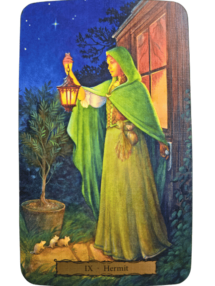 A Tarot of the Witch's Garden card labeled IX Hermit shows a woman in a green cloak and hood holding a lantern at night, standing by a house. She faces a potted tree, with three white mice at her feet and a starry sky above.