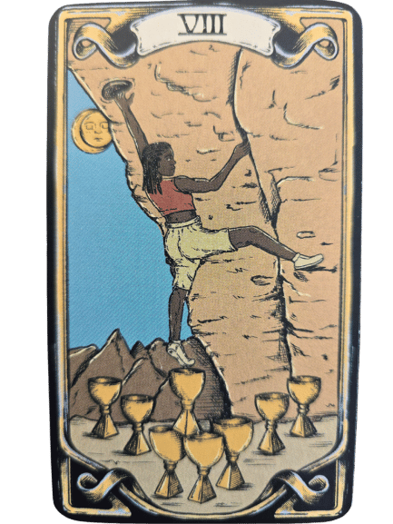 A card from The Sacred Sisterhood Tarot labeled VIII shows a person climbing a rocky cliff under a yellow moon, leaving behind eight golden cups on the ground. The blue sky and distant mountains complete the mystical scene.