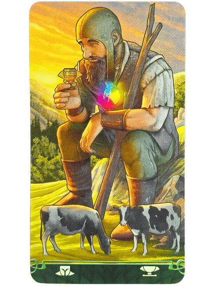 A bearded man in armor squats in a field at sunset, holding a small goblet near his face—a scene from Tarot at the End of the Rainbow. Two cows graze nearby as a glowing, colorful gem shines at his chest amid green hills and trees.