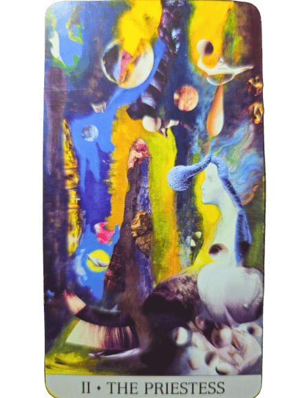 A colorful tarot card from the Japaridze Tarot titled II • THE PRIESTESS shows a surreal, dreamlike scene with a blue-haired woman, floating spheres, abstract shapes, and a bright blue and yellow background.