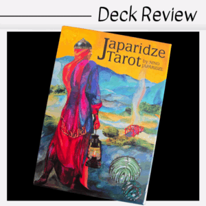 A colorful box of the Japaridze Tarot deck features an illustrated figure in a red and blue robe holding a lantern, facing a surreal landscape; “Japaridze Tarot by Nino Japaridze” text is clearly displayed on the box.