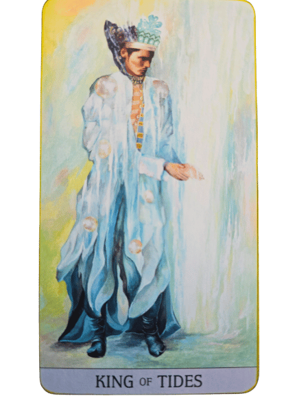 A tarot card from the Japaridze Tarot, titled King of Tides, shows a regal figure in a flowing, translucent blue robe and ornate crown, standing gracefully with one hand extended against a dreamy, watery background.